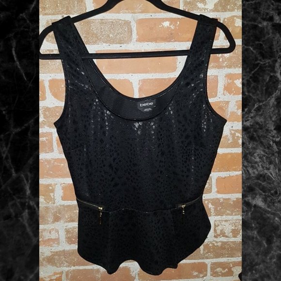 Bebe Animal Print Peplum Top. Medium. - Picture 1 of 1